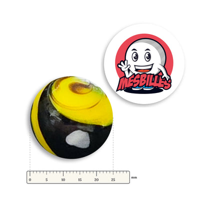 Bille Big-Bang Jaune et Noir 25 mm Collector à côté d'une règle graduée, 25 mm de diamètre