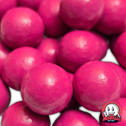 Collection de billes en terre multicolores avec plusieurs billes rose 16 mm au premier plan, ambiance ludique et colorée