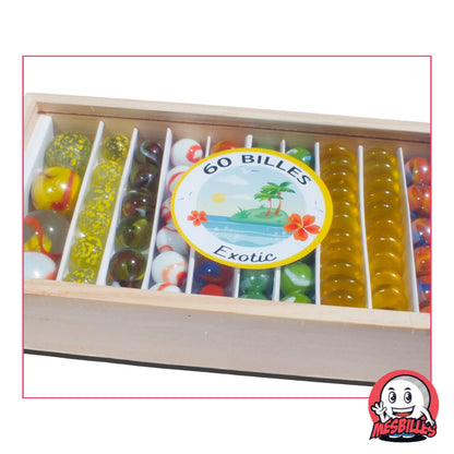 Coffret 60 billes Exotic : motifs tropicaux, couleurs ensoleillées et coffret bois. L’évasion est dans la boîte !